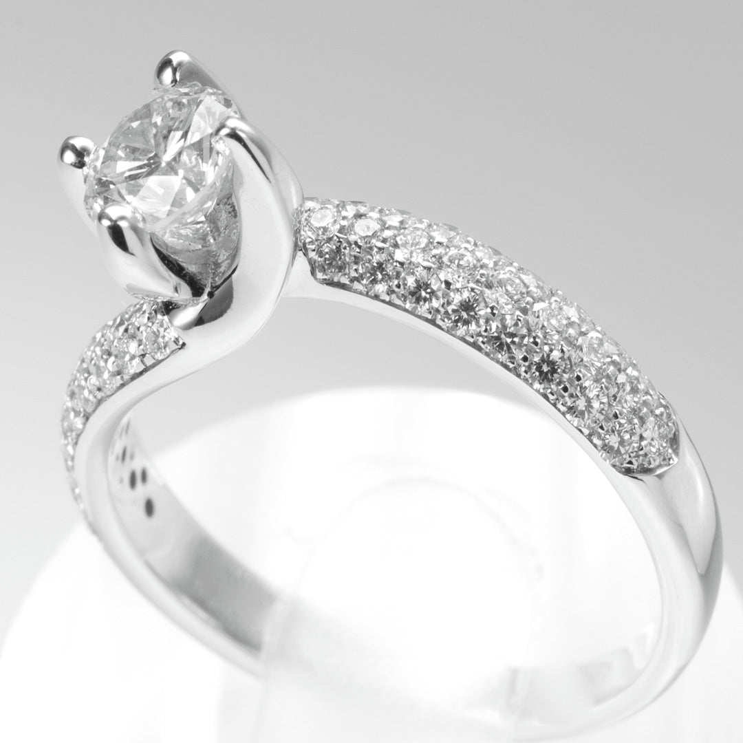 Anello solitario Valentino diamante 0.60ct G VS2 mezzo pavé oro bianco 18kt